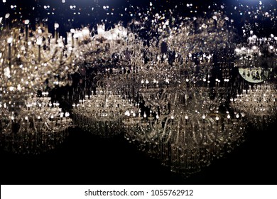 abstract shining light with chandelier crystal in dark night. Luxury star light in dark for nackground concept
