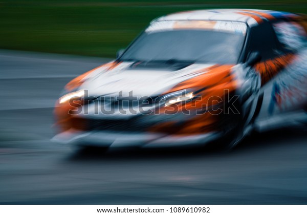 Abstract shot of car on the training race track.\
Extreme long exposure\
image.