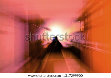 Abstract shot of scary silhouette in room. Concept of spirits, ghosts and astral travel