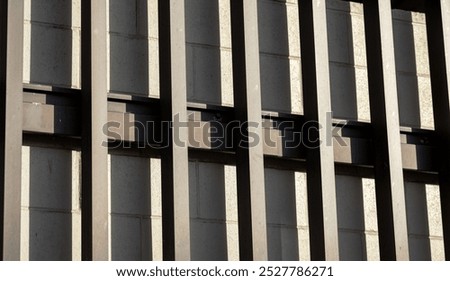 Abstract Side View of a Tan Wall with a Brown Facade and Shadows.