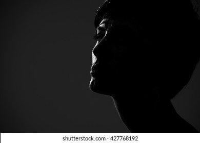 Abstract silhouette portrait of short hair woman looking at camera