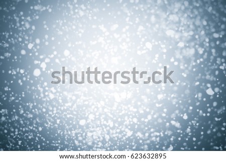 Abstract silver background with white particles. Round bokeh or glitter lights. Design template