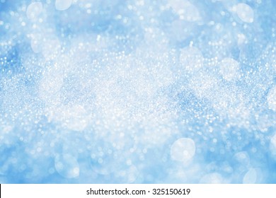 Abstract silver light on blue blurred background