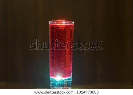abstract single red cocktail on bright light background