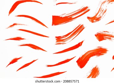 Abstract Smears Of Orange Paint On White Background