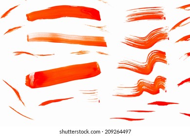 Abstract Smears Of Orange Paint On White Background