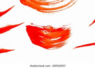 Abstract Smears Of Orange Paint On White Background