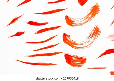 Abstract Smears Of Orange Paint On White Background