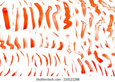 Abstract Smears Of Orange Paint On White Background