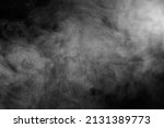 Abstract smoke texture over black. Fog in the darkness.