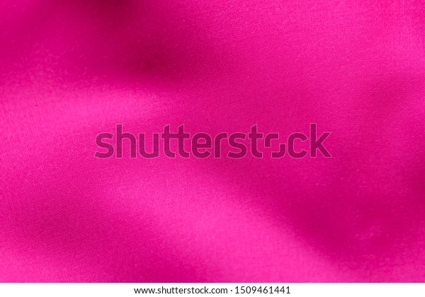 Abstract smooth soft pink fabric sweet color  and wave\
texture surface background or backdrop blank wall and empty for\
copy space 