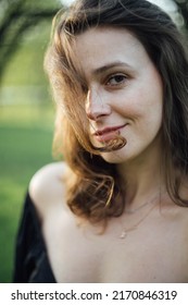 Abstract Soft Focus Portrait Of A Young Woman In Backlight In Nature