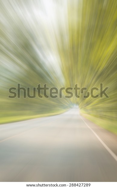 Abstract speed lines on\
highway.