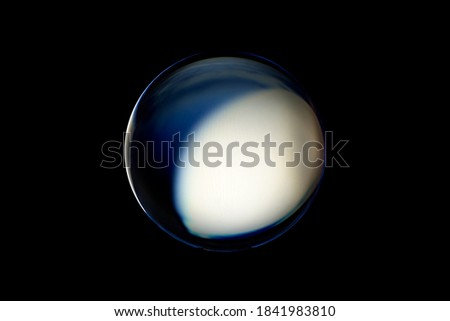 An abstract sphere with a blurry pattern isolated on black background. Abstract circle in blur.