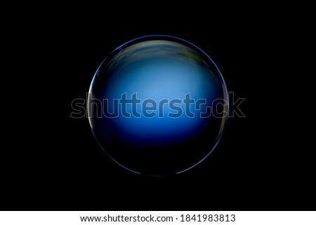 An abstract sphere with a blurry pattern isolated on black background. Abstract circle in blur.