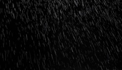 Abstract Splashes Of Rain And Snow Overlay Freeze Motion Of White Particles On Black Background