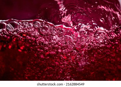 Abstract splashing of red wine. Macro shot.
