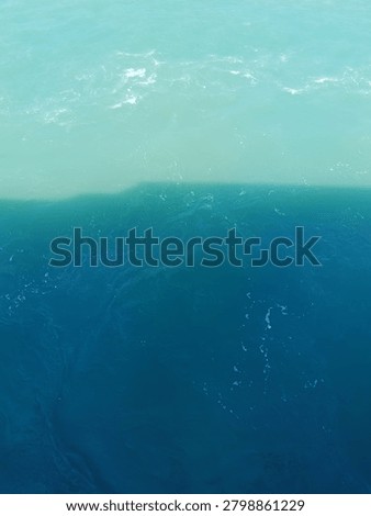 Abstract split tone of turquoise and dark blue sea water surface background