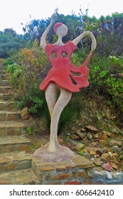 Abstract Stone Sculpture of a Female in a Pink Dress