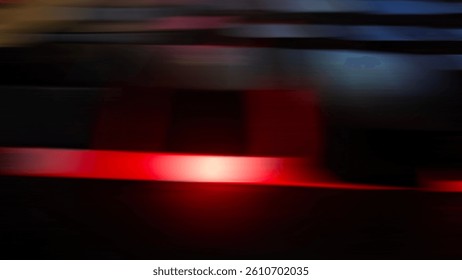Abstract streaking motion blur of red light creates a trail suggesting fast movement and energy. Ideal for dynamic backgrounds.
