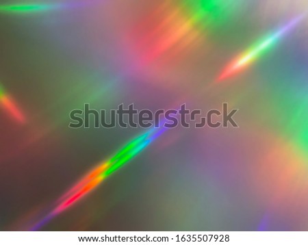 Abstract streaking rainbow light flares background or overlay