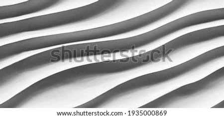 abstract striped of stone texture, curve sculpture. Close-up of black geometric shapes line.