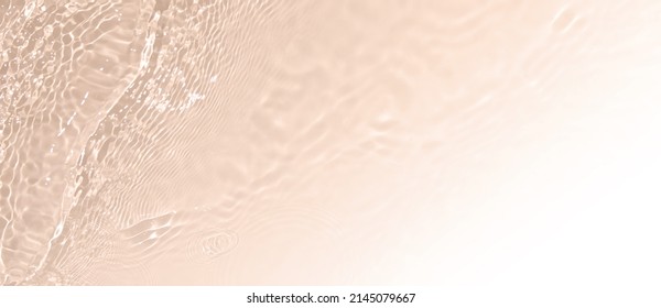 Abstract summer banner background Transparent beige clear water texture and ripples   splashes  Water waves copy space and white gradient  top view  Cosmetics moisturizer micellar toner emulsion