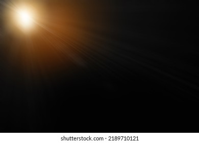 Abstract sun flare over black background. lens flare effect Golden sun light.
 - Shutterstock ID 2189710121