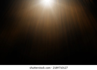 Abstract sun flare over black background. lens flare effect Golden sun light.
