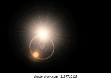 Abstract sun flare over black background. lens flare effect Golden sun light.
