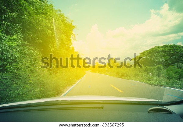 abstract sun light and car and road to\
forest - can use to display or montage on\
product