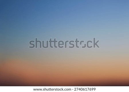Abstract sunset gradient over blurred ocean horizon