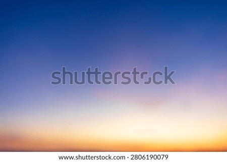 Abstract Sunset Sky Gradient Background,A soft, smooth, and dreamy gradient of the evening sky transitioning from deep blue to warm orange and yellow hues at sunset, perfect for creative backgrounds or design projects.
