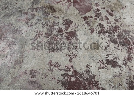 an abstract surface texture of smooth brown concrete stone with sand unevenly scattered on the surface 