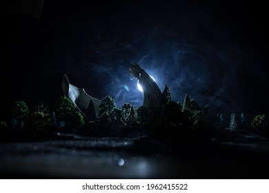 Abstract surreal concept  Giant animal bone in dark forest under moonlight  Night and fog   light background  Selective focus