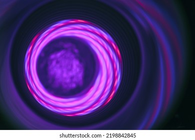 Abstract swirl tunnel with purple light on a background pattern textured for design.