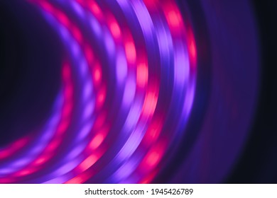 Abstract swirl tunnel with violet light on a background pattern textured for design.