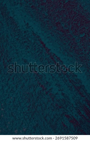 Abstract teal texture with deep blue tones and subtle red veins