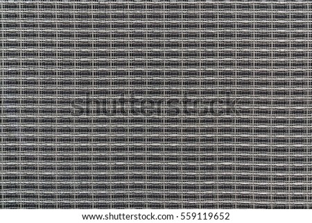 Abstract techno background with interwoven gray shiny metal wire, closeup