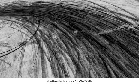 Abstract texture and background of car tire drift skid mark on road race track, Black tire mark on street race track, Automobile and automotive concept.