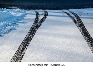 Abstract Texture And Background Of Car Tire Mark On Snowy Road. Automobile And Automotive Concept. Top View, View From Above.
