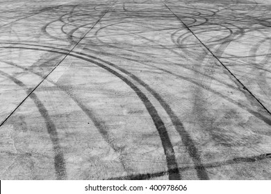 Abstract texture and background of car tire drift skid mark on road race track, Black tire mark on street race track, Automobile and automotive concept.