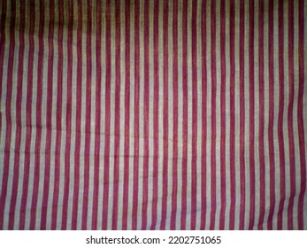 Abstract Texture Background. Fabric With Vertical Stripes Of Crimson Color.