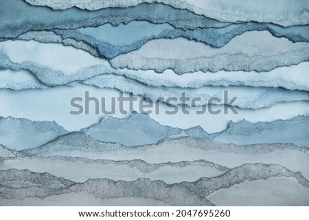 Abstract texture background. Layers of watercolor painted paper. Torn edges.