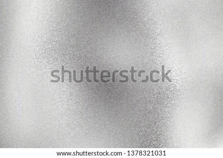 Abstract texture background, shiny silver foil wave metal wall