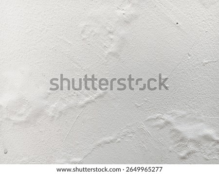 Abstract texture of blistering or bubbles paint on a white wall.	