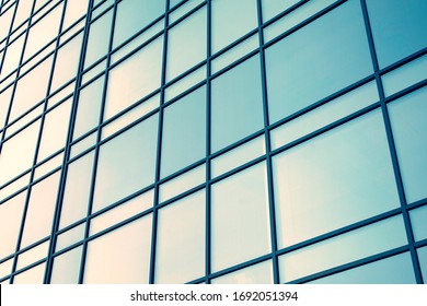Abstract texture and blue glass facade in modern office building., Retro stylized colorful tonal filter effect.