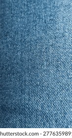 Abstract texture captured from a close-up of denim fabric, revealing fine blue and gray threads. A detailed and artistic perspective of everyday material turned into a visually striking pattern.