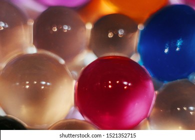 Abstract texture, color balls of hydrogel for the background. Hydrogel beads. Close up.