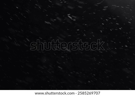 Abstract texture. Falling snow isolated on black background. Layer to overlay and blend snowfall into your photo project.